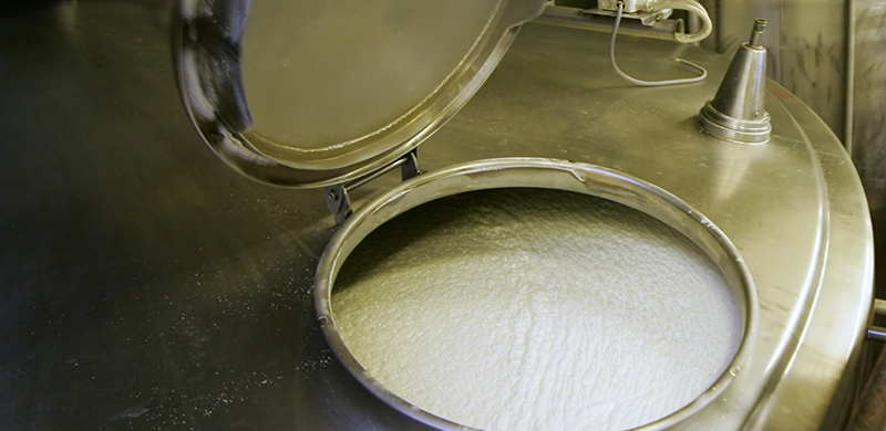 dairy cream being processed in a vat