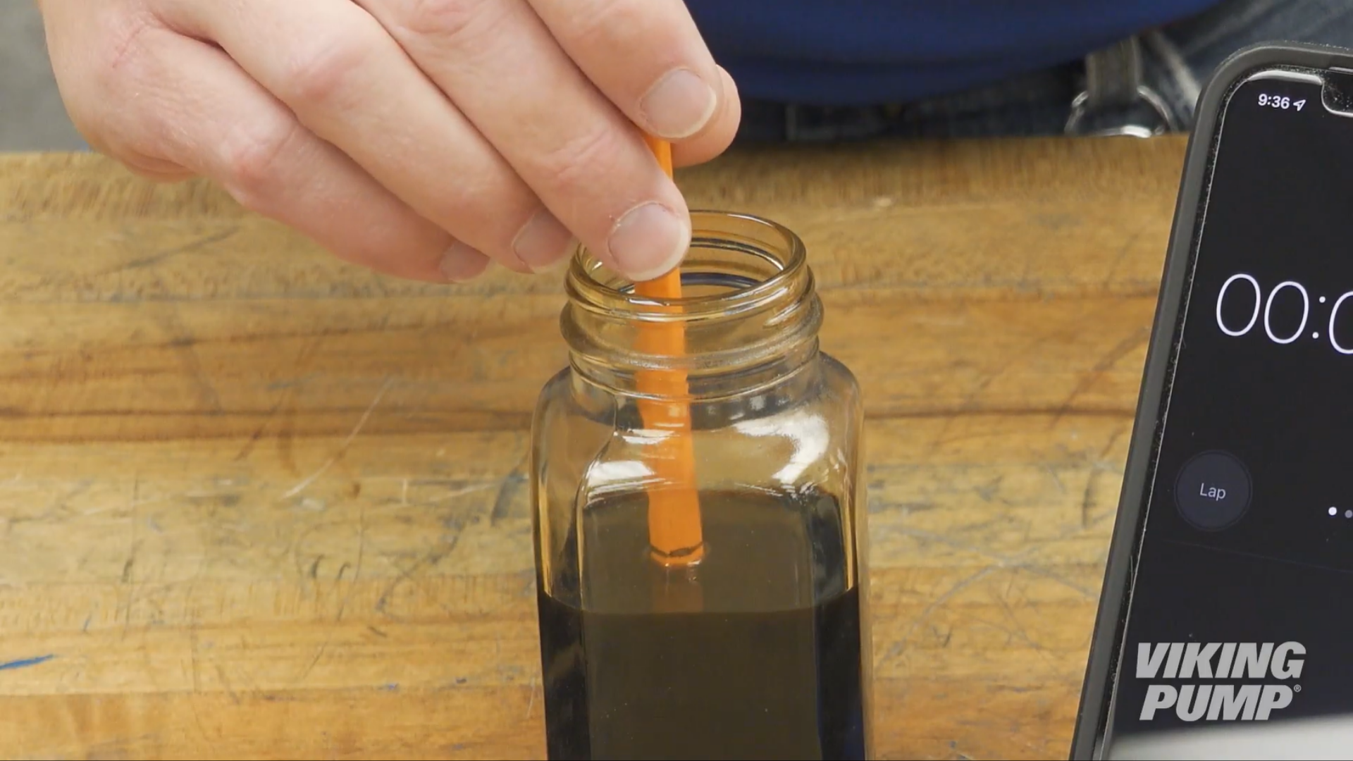 STEP 2: Dip the pencil into the liquid, sharpened end first, up to this line.