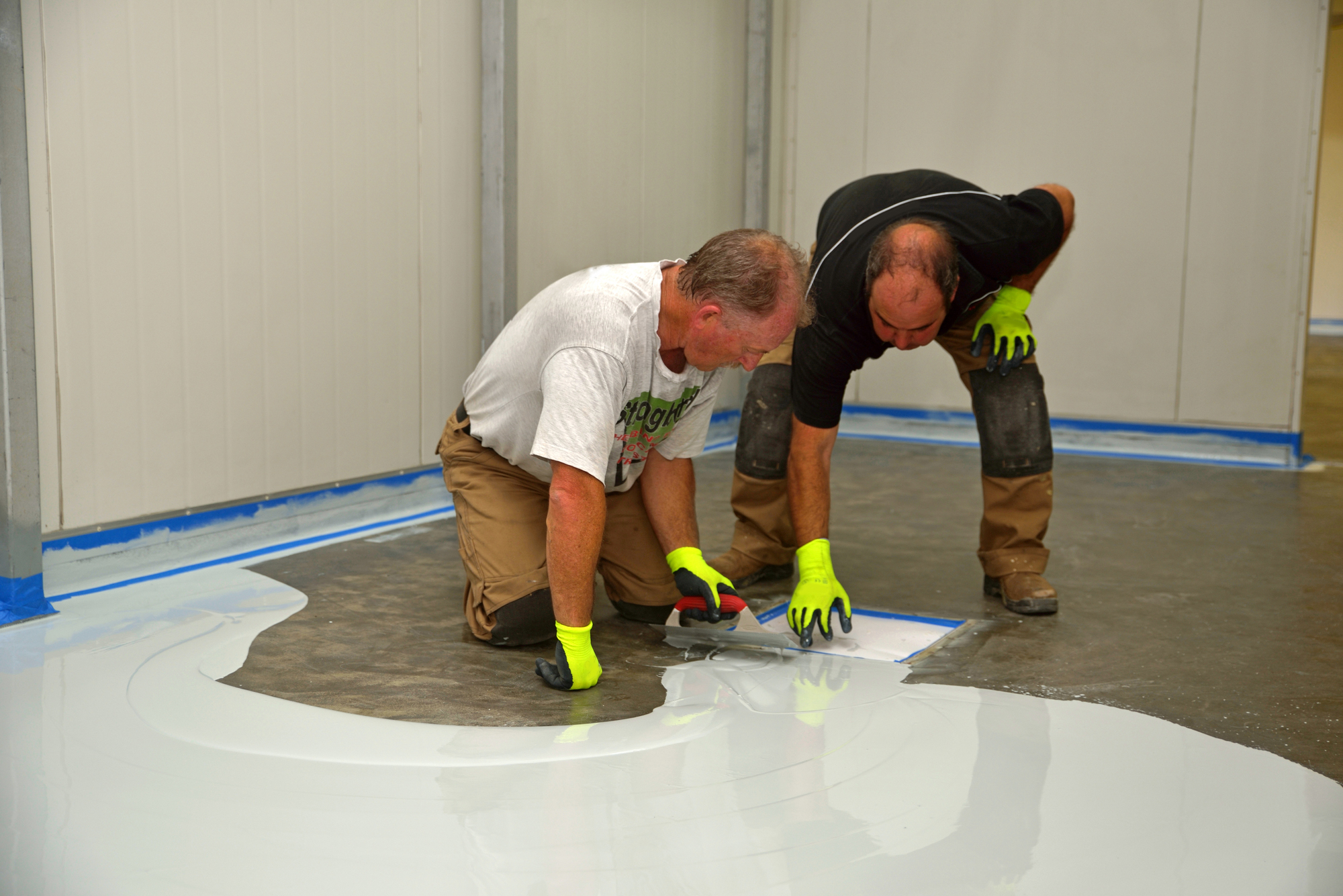 people pouring floor resin